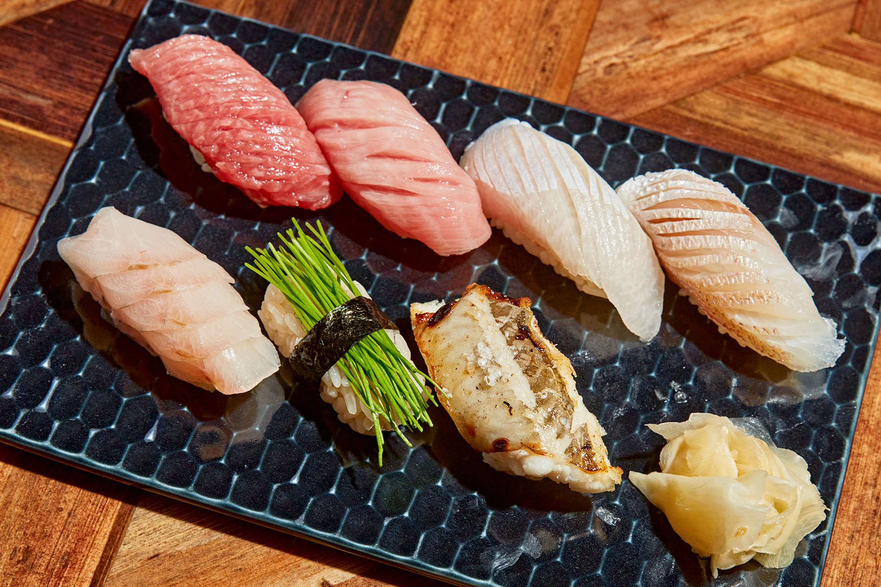 Tatsu Dallas signature dishes Seasonal multi-course omakase menu.
